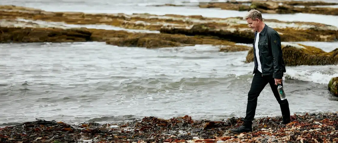 Gordon Ramsey on the beach with Ramsey Gin